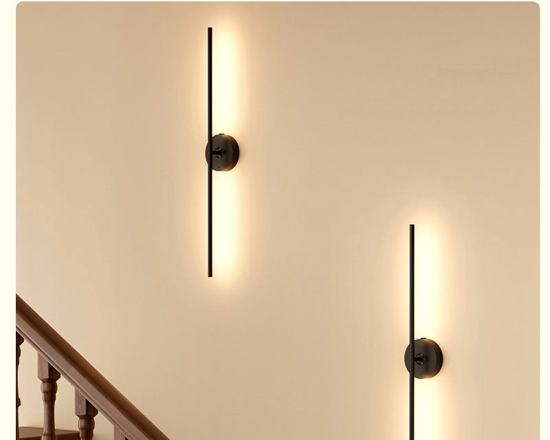 Stairway lit by rechargeable wall lights